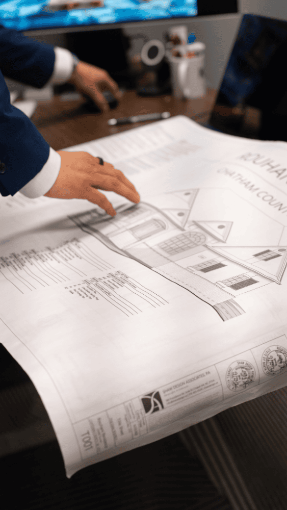 Work & Social Insider Series  Jon Barnett and Social Work&Social Private Office for Rent in Car Space Raleigh Showing Karma Construction Blueprints